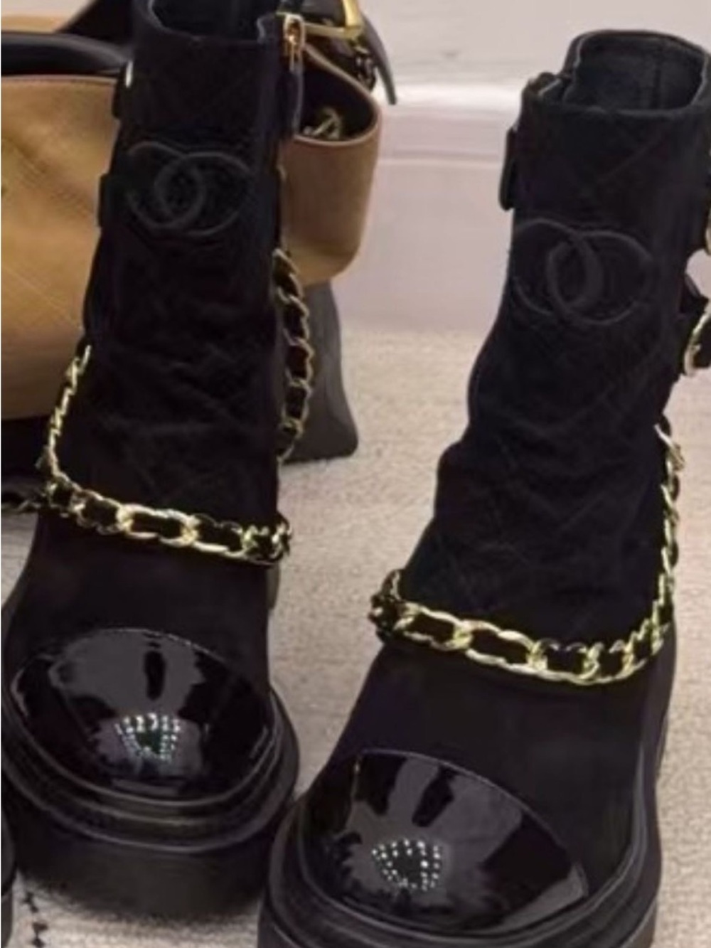 CHANEL Black Quilted Ankle Boots with Gold Chain Trim